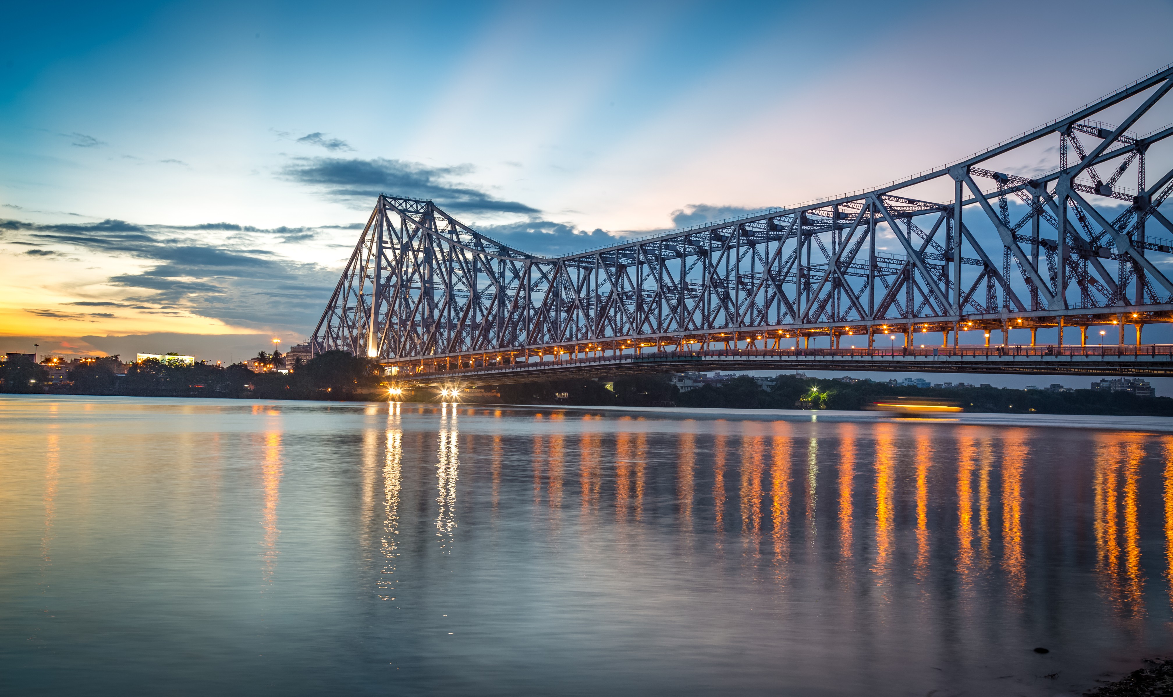 Howrah bridge - The historic cantilever bridge on the river Hooghly with twilight sky.